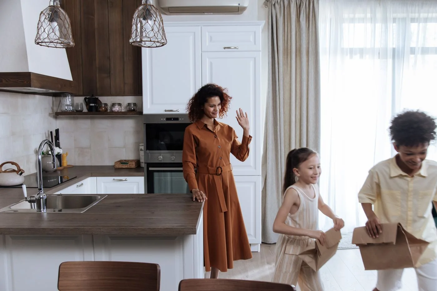 An adult and a child in a bright kitchen