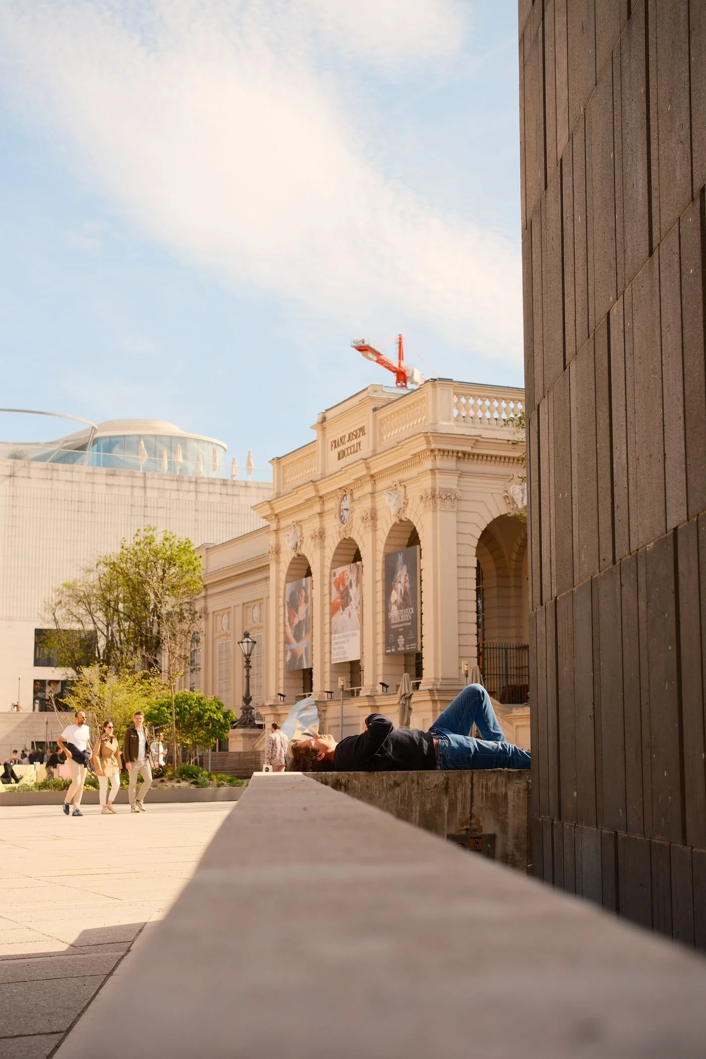 Pale buildings and arches in Vienna’s MuseumsQuartier