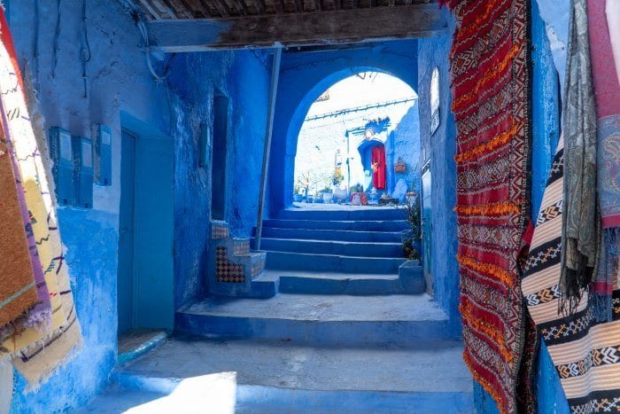 Blue street with rugs