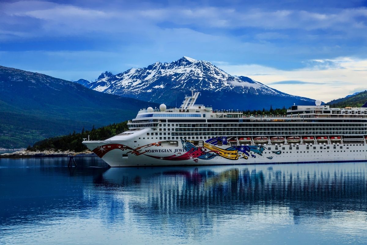 Cruise ship in front of mountain