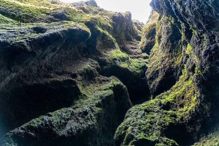 Looking up at the green cliffs in the Raudfeldsgja gorge