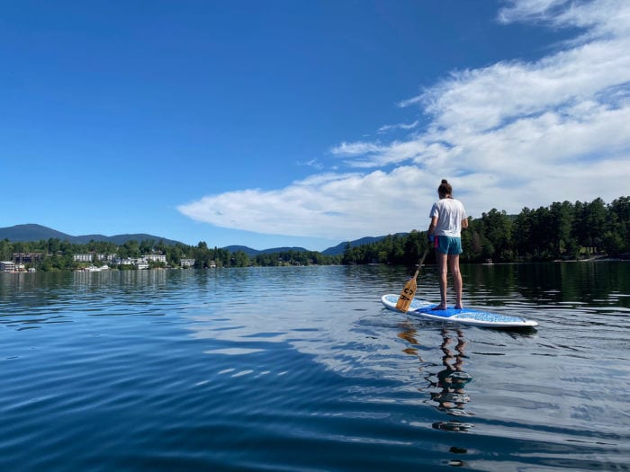 girl paddle boarding on Mirror Lake