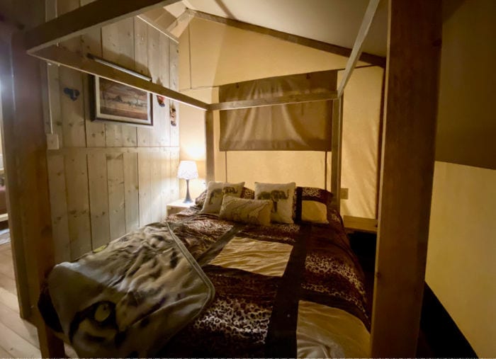 KOA glamping tent main bedroom with queen four poster bed