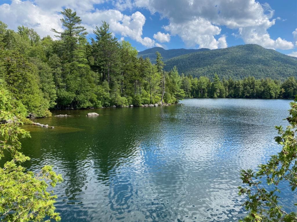Copperas Pond with trees and mountains in the background