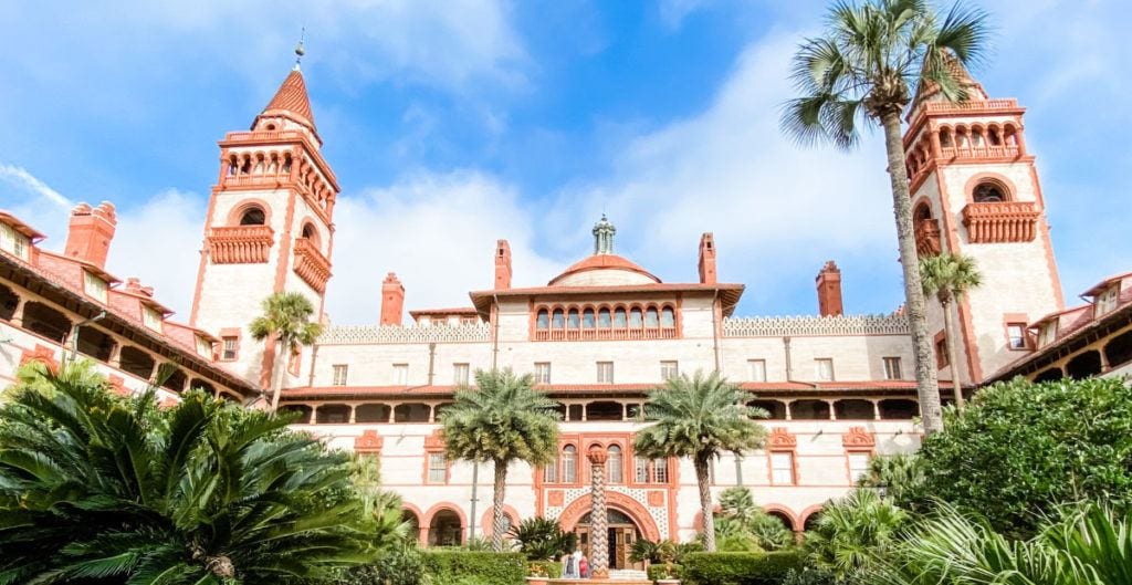 Flagler college bell towers and entrance with palm trees
