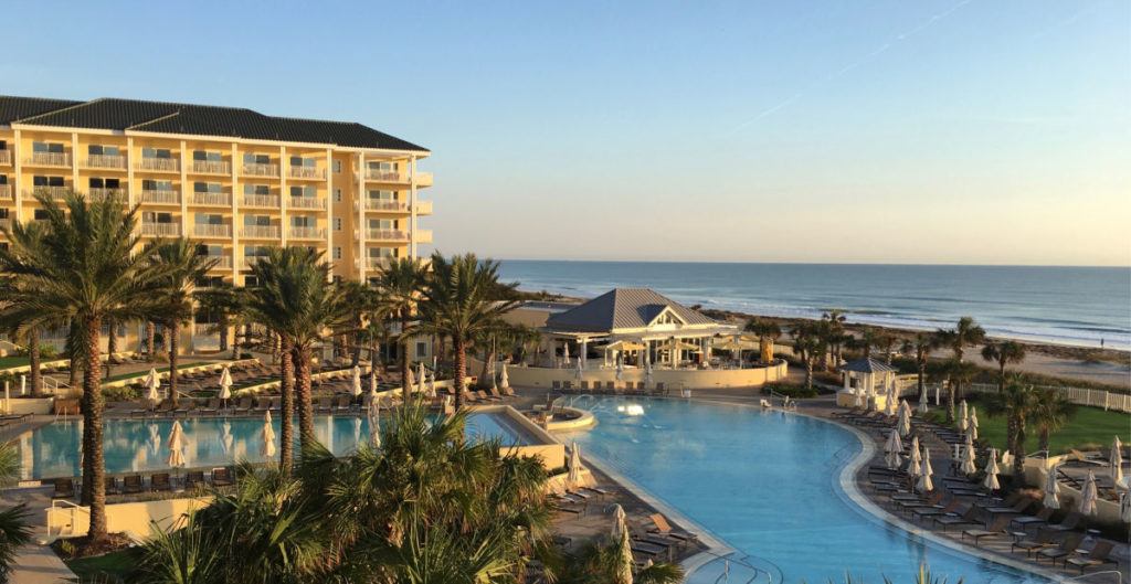 Omni Hotel Amelia Island pool and towers with ocean in the background
