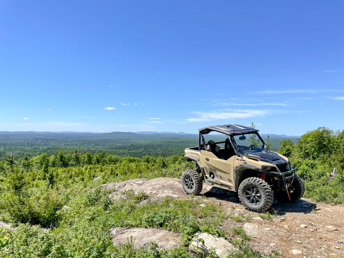Side by side off road vehicle on mountain top