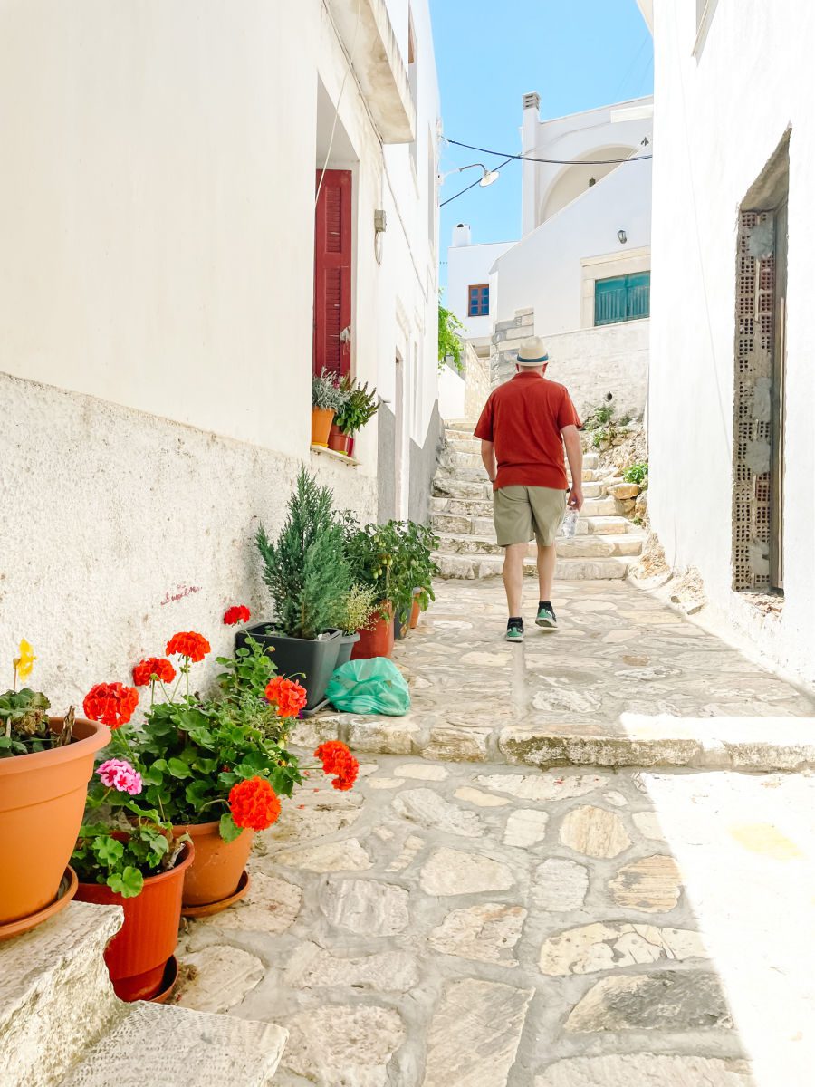 Man walking up steps in town of Apeiranthos