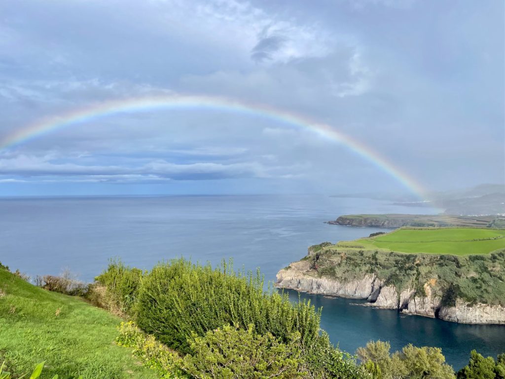 Miradouro de Santa Iria in Sao Miguel with a rainbow over the water
