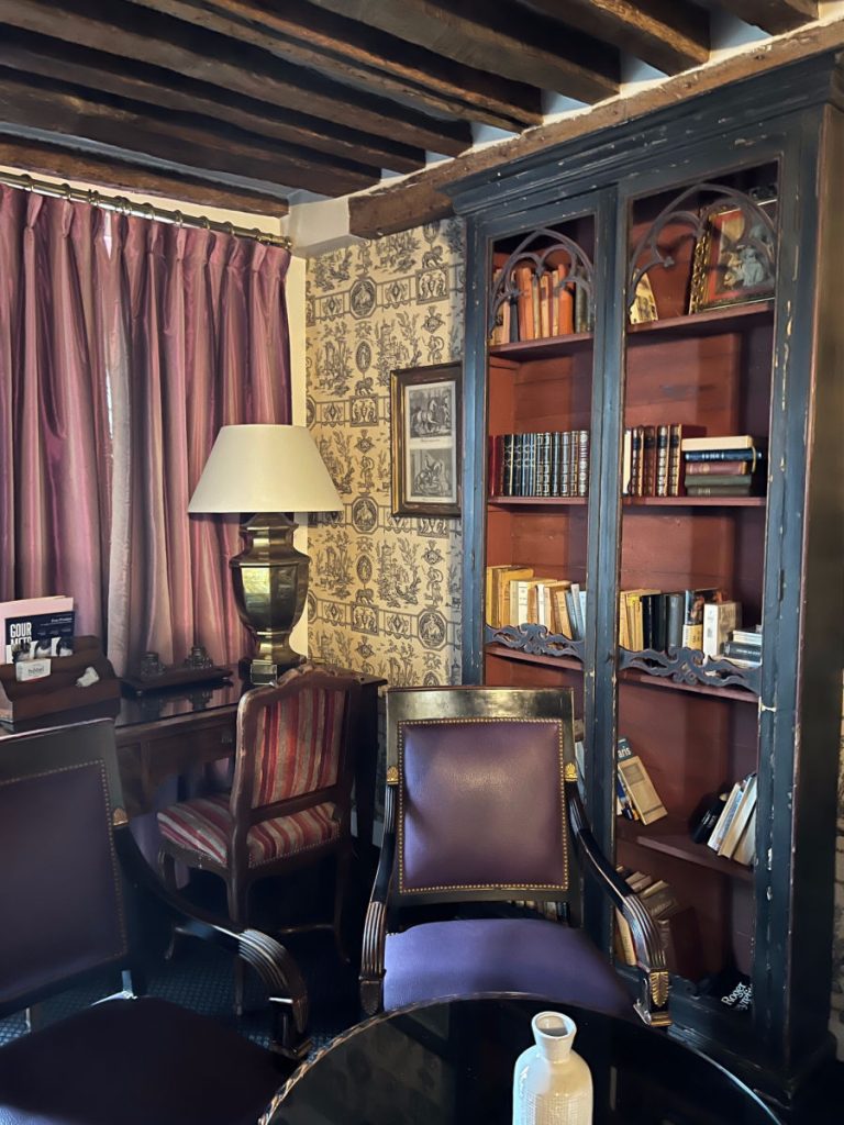 Bookshelves and desk area of superior room