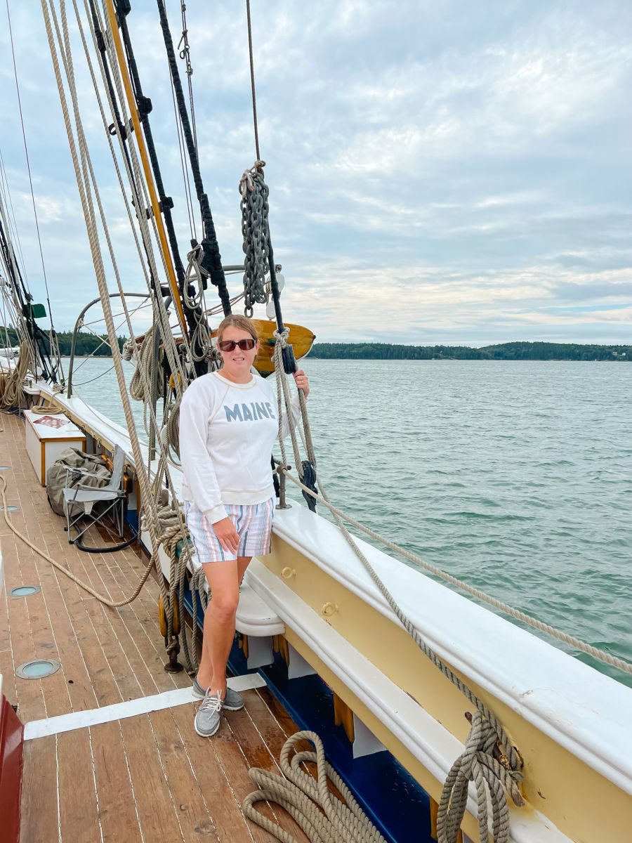 Tamara on deck in Maine sweatshirt
