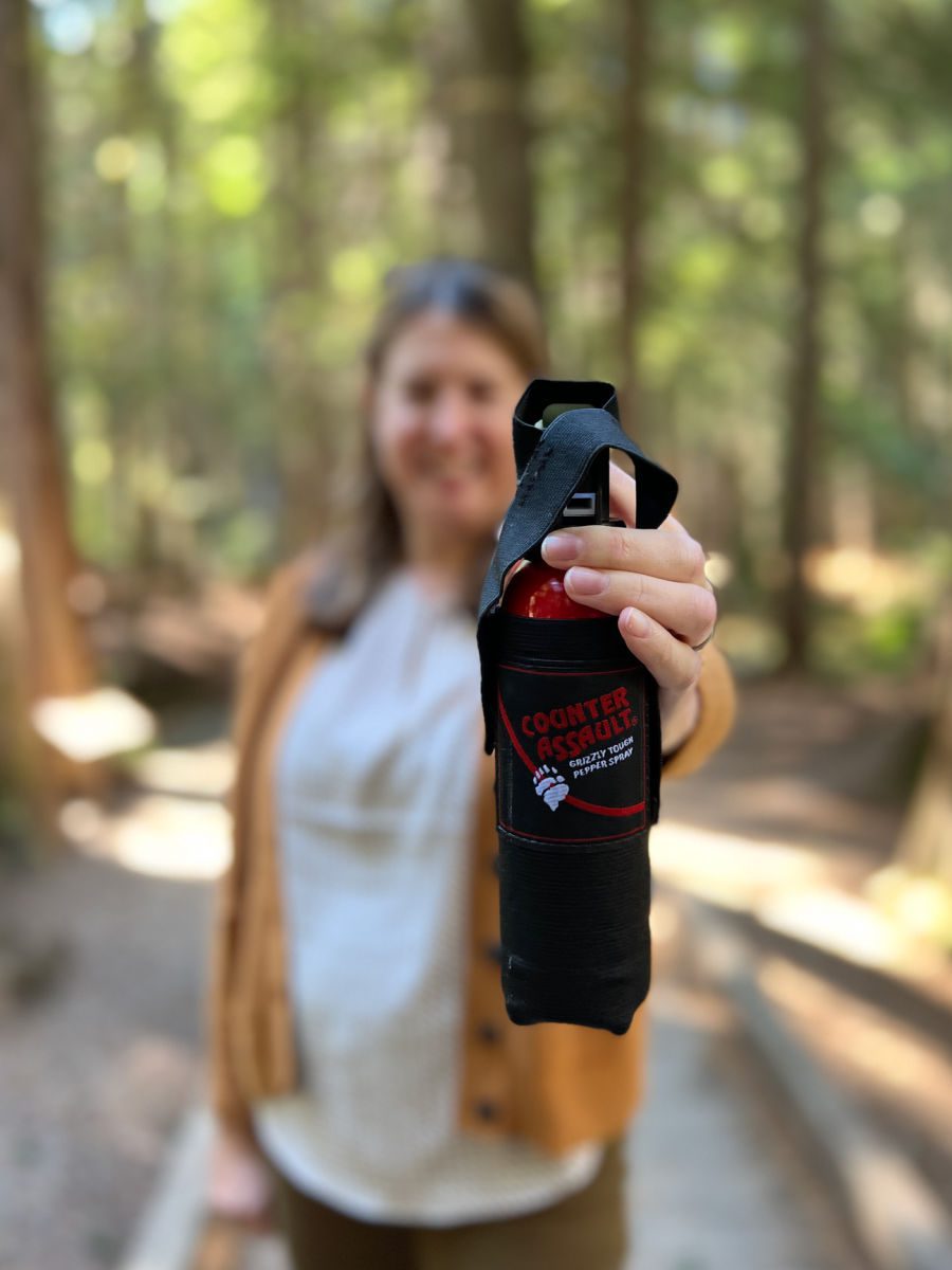 Woman holding bear spray
