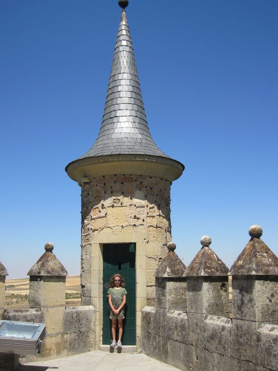 Girl standing in castle turret in Segovia Alcazar
