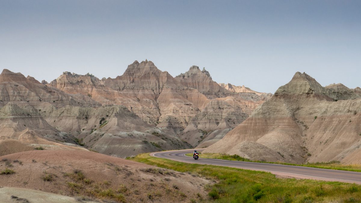 visit Badlands National Park - motorcycle on road