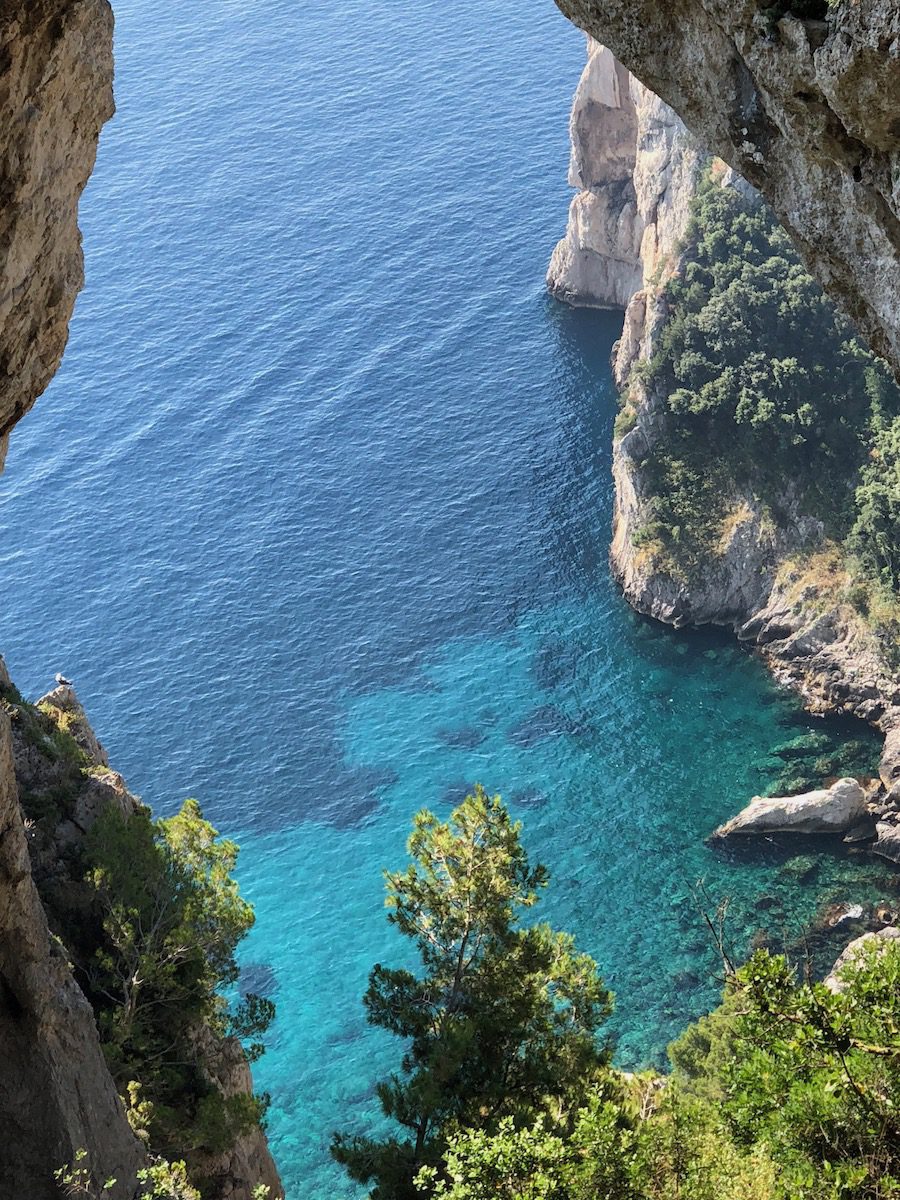 looking down at the water through the Natural Arch