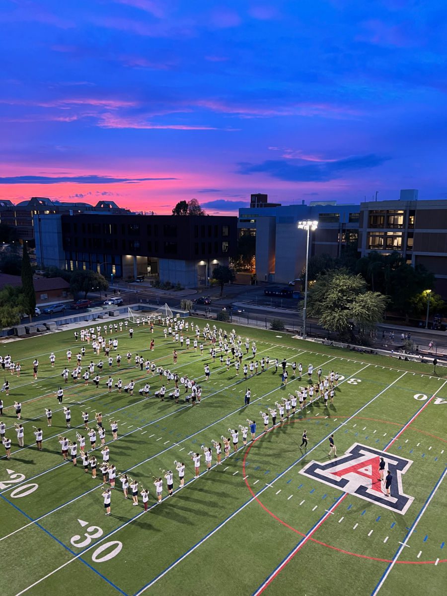 Pride of Arizona band practicing at sunset
