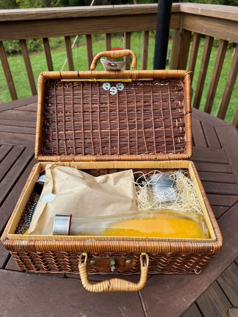 Breakfast basket with orange juice carafe