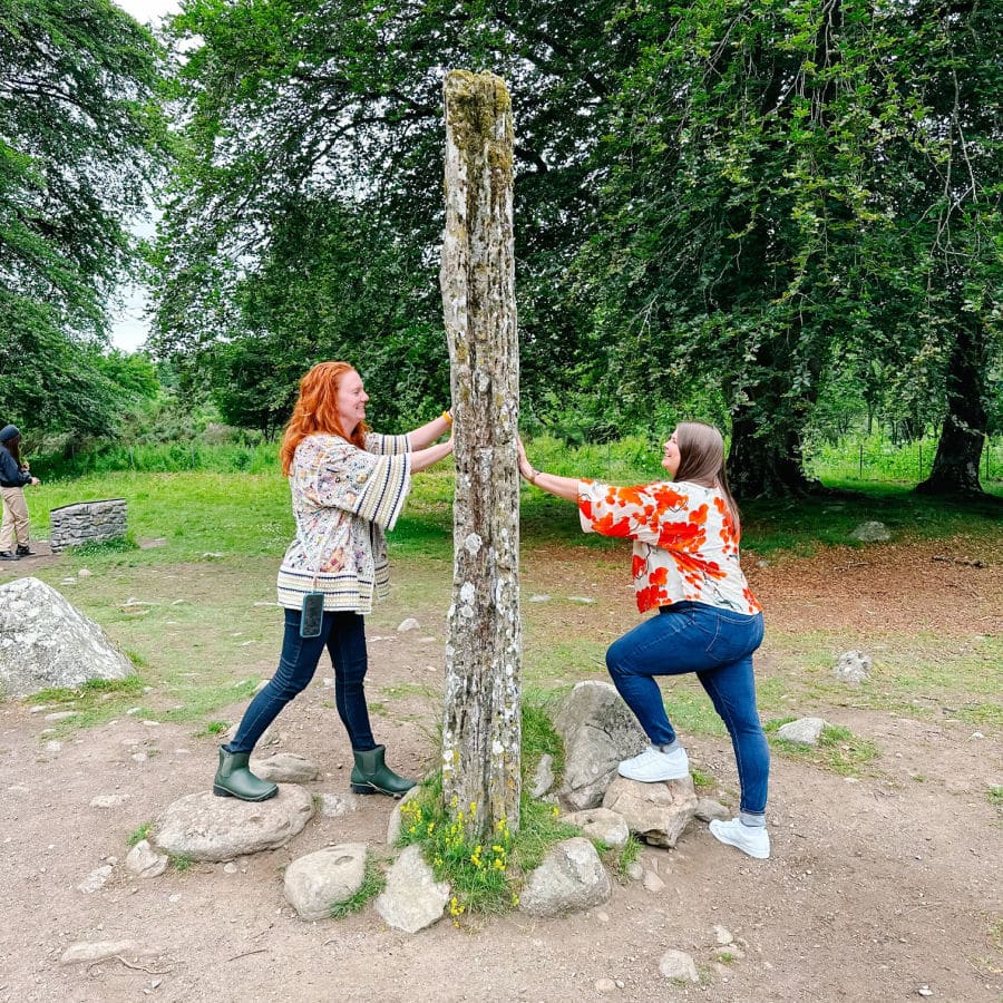 Keryn and Amanda touching standing stone