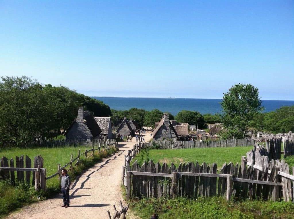 View of village with path overlooking sea