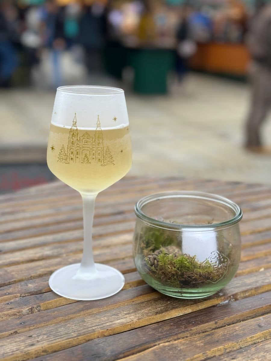 apple wine or white gluhwein on wood table