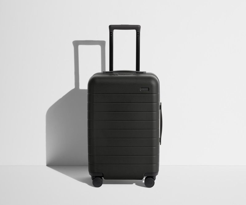 A hard-shell carry-on (20–22