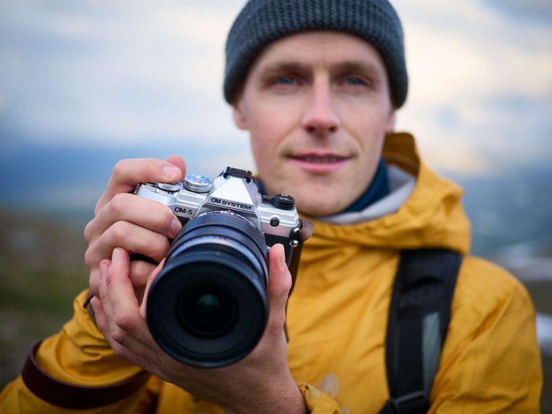 OM SYSTEM OM-5 (mirrorless, Micro Four Thirds) — ~414 g (with battery/card)