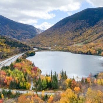 View of Echo Lake and fall leaves in NH from Artists Bluff