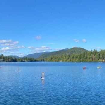 Paddle boards and kayaks on Mirror Lake new york