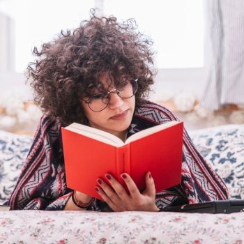 Teen girl reading a book