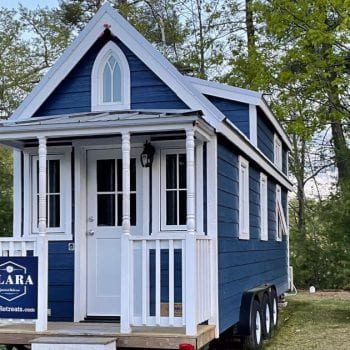 Blue and white Clara style tiny house at Tuxbury Pond
