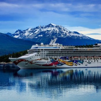 Cruise ship in front of mountain