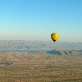 Hot air balloon over lake in Scottsdale
