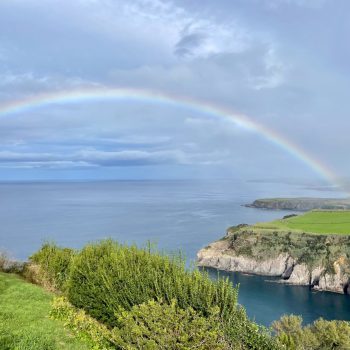Miradouro de Santa Iria in Sao Miguel with a rainbow over the water