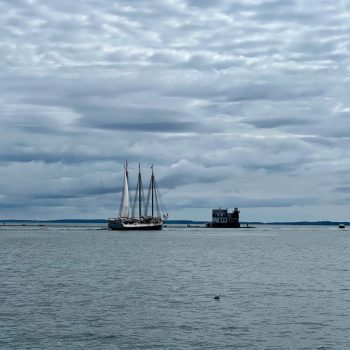 Victory Chimes schooner in front of the Rockland Harbor breakwater light